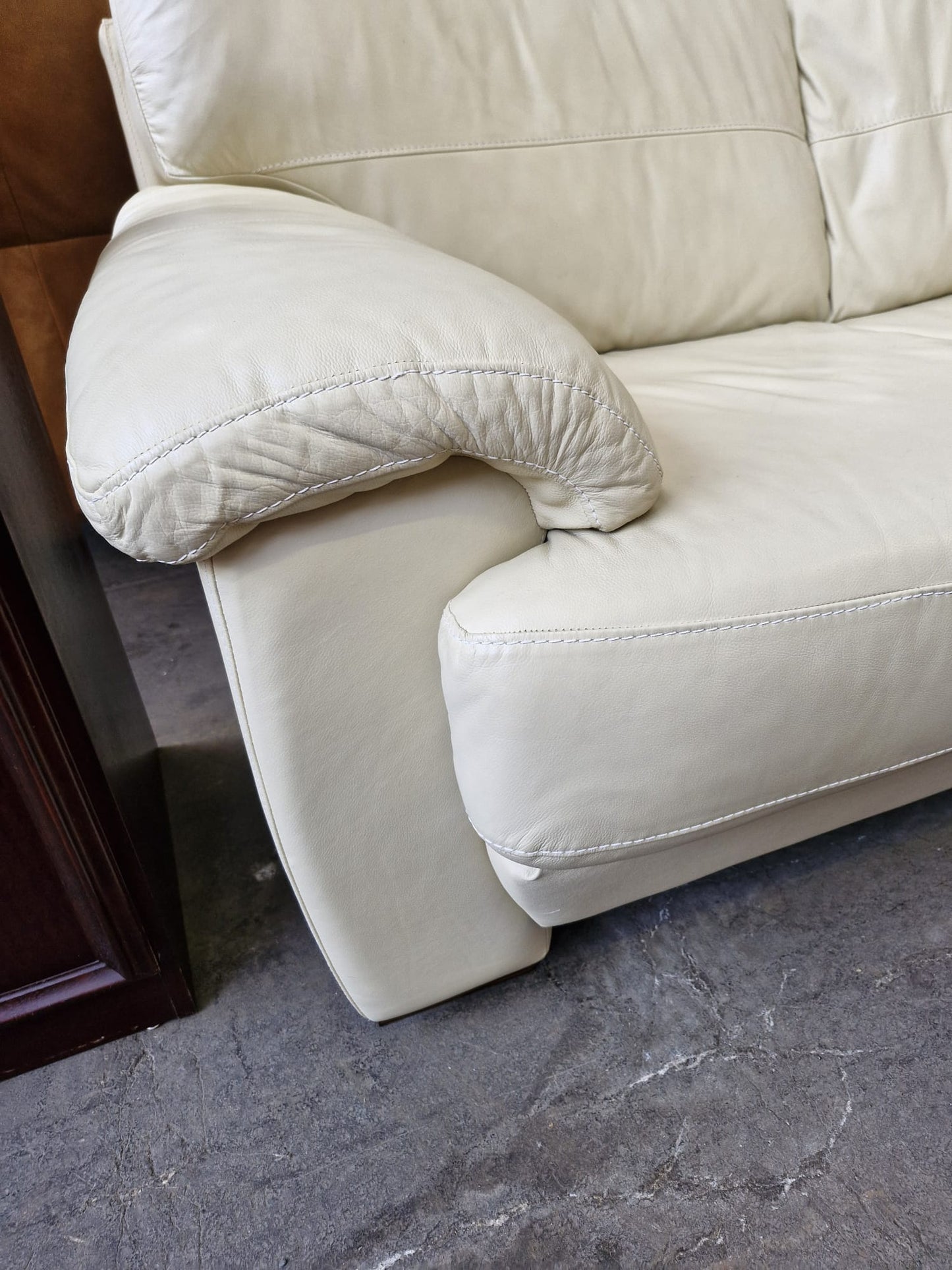Cream leather 2 seater sofa